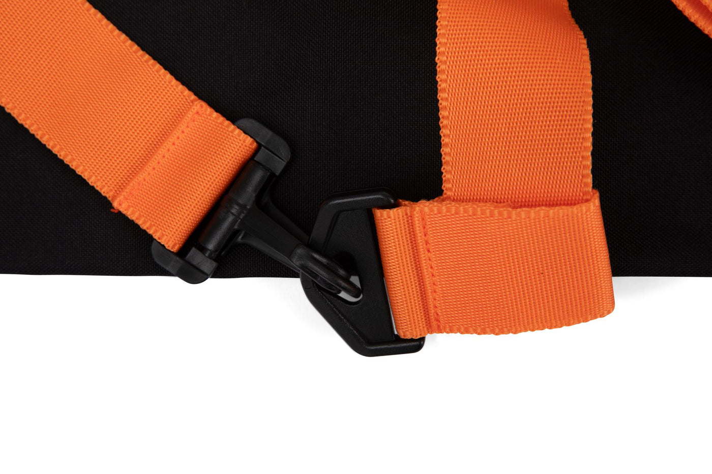 Detailed studio image of the hooks on the Stick Mobility training stick carry bag, securely latching onto the straps, showcasing durability and functionality, photographed on a white background.
