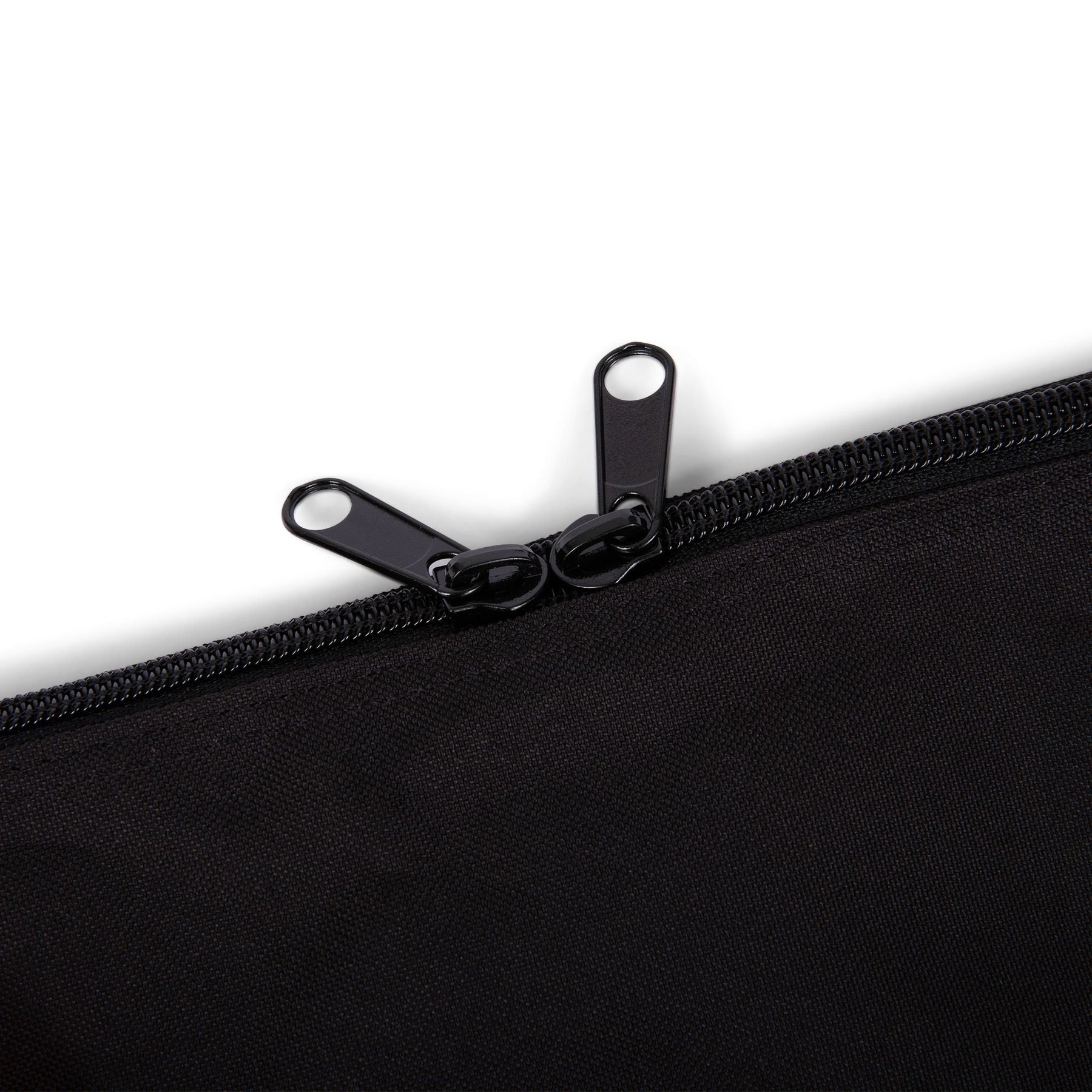 Studio image of the zipper on the Stick Mobility training stick carry bag, highlighting its sturdy construction and smooth functionality, photographed on a white background.