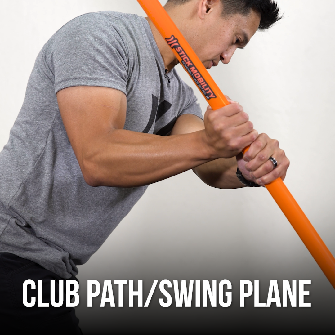 Man using a Training Stick to demonstrate golf club path/swing plane.