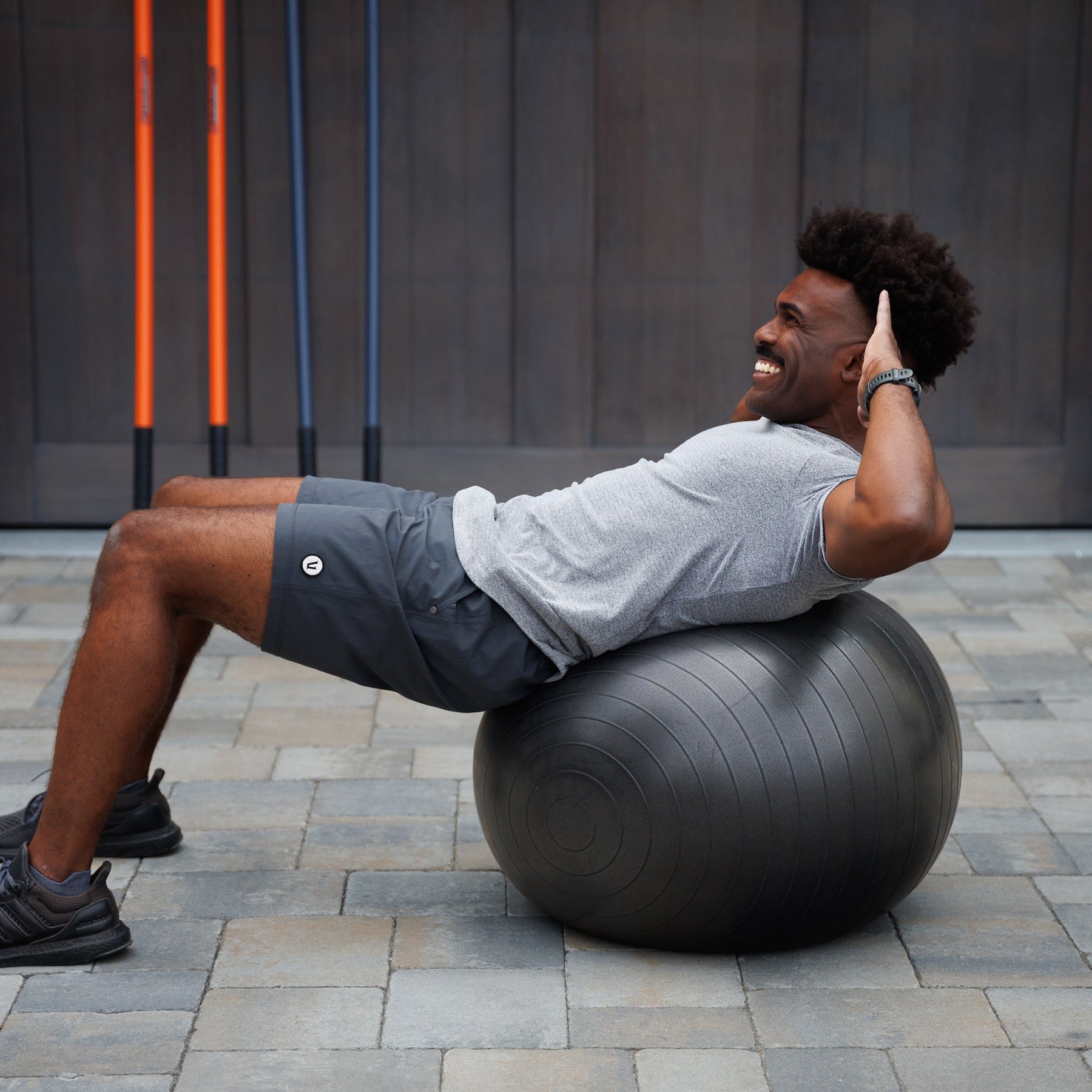 Man performing a sit up using an exercise ball