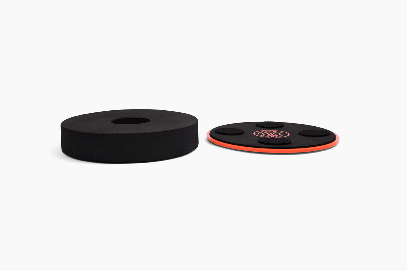 Studio image of the Stick Mobility TriSlider with both top and bottom pieces intact, displayed on a white background, showcasing its complete design and functionality for mobility and stability training.