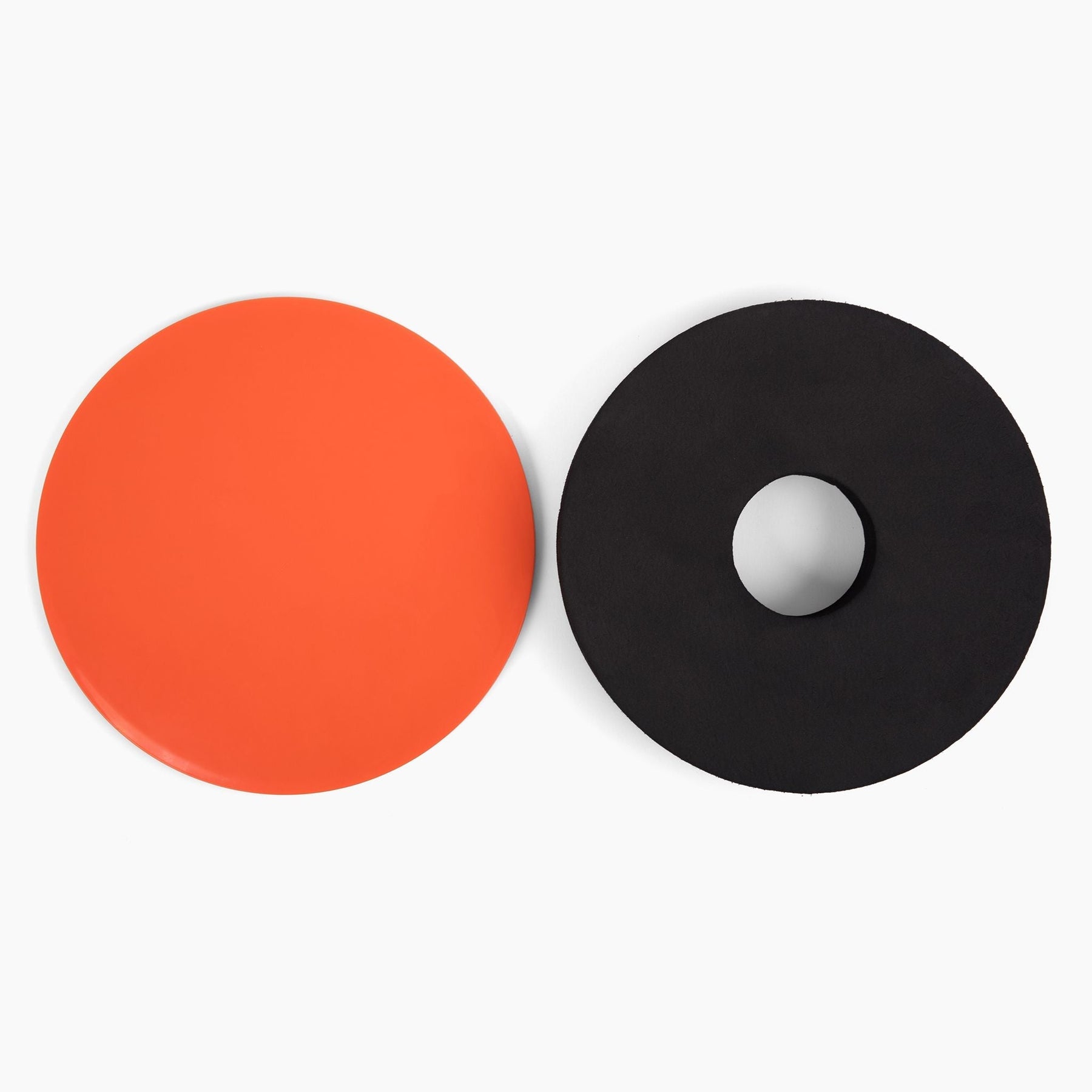 The TriSlider taken apart showing the Slider on the left and the foam pad for balancing or using with your Training Stick on the right.