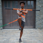 Man Standing on one leg using Torsion Strap